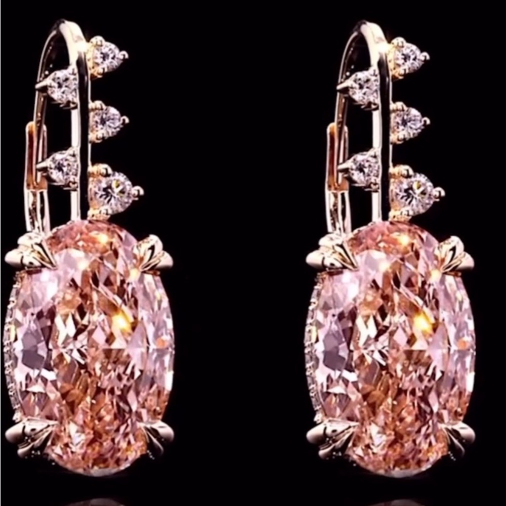 A pair of pink oval diamond earrings, total weight, 10 carats